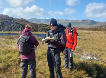 Mountain Leader trainees navigating on a course