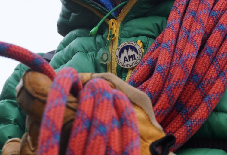 A Mountaineering Instructor holding rope