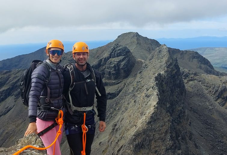 Two climbers enjoying the views of Am Bastier